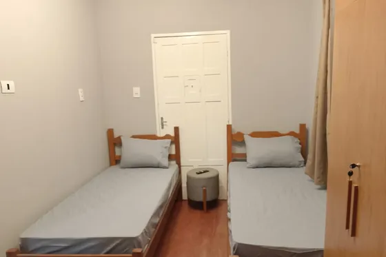 Clínica de reabilitação em Nova Serrana - MG Dois camas em dormitório de acomodação
